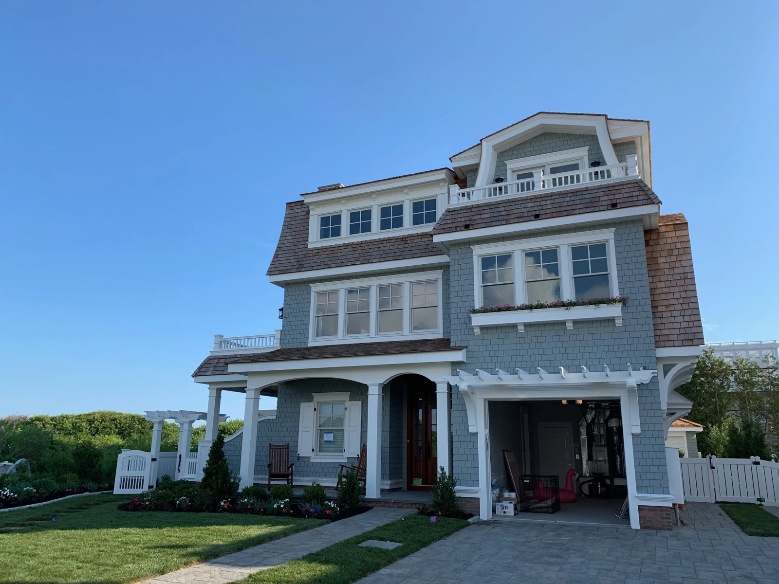 Red Cedar Construction project featuring gray shingle siding and white trim